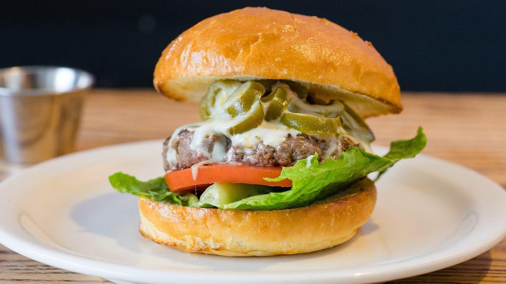 TNT Burger
 · With jalapenos and pepper jack cheese. Served with lettuce, tomatoes, house made garlic, and infused aioli. Cooked medium.
