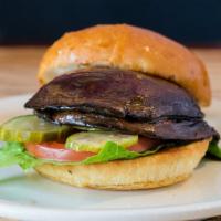 The Lolo Burger · Vegetarian. Fried Portobello mushroom, garlic-dill marinade. Served with lettuce, tomatoes, ...