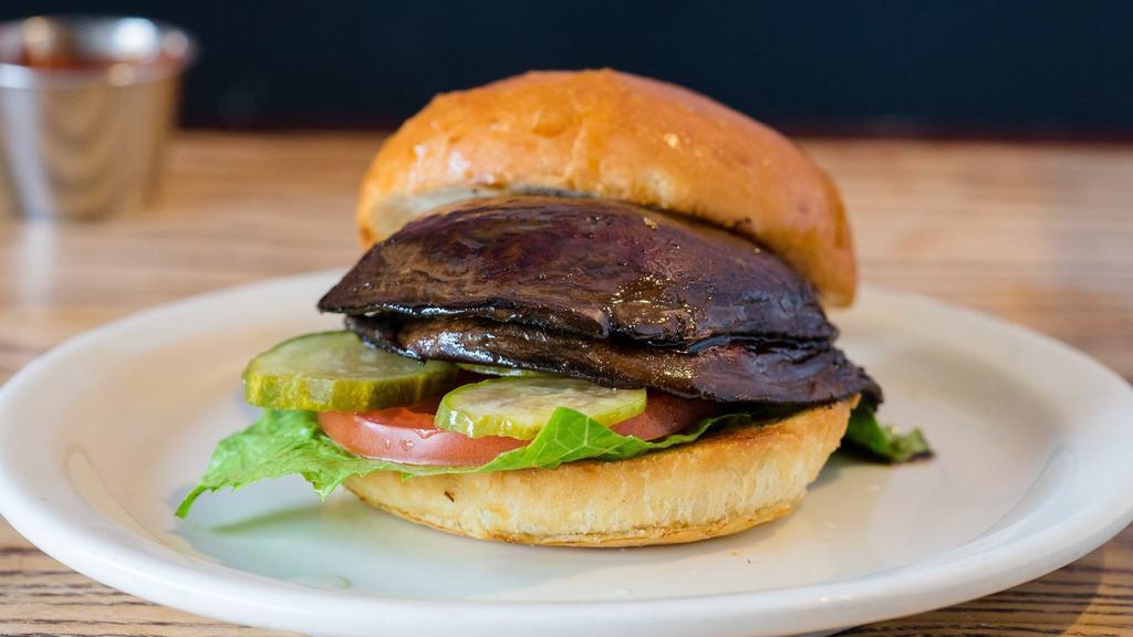 The Lolo Burger · Vegetarian. Fried Portobello mushroom, garlic-dill marinade. Served with lettuce, tomatoes, house-made garlic and infused aioli. Cooked medium.