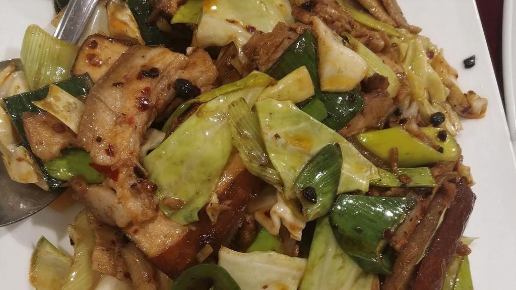 #68. Szechuan Twice- Cooked Pork  回锅肉 · Spicy. Sliced pork belly, leek, cabbage, jalapeno, bean curd tofu.   **** Additions of items will increase $ 1.00/item