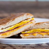 Jamón, Queso y Huevo · Ham, egg and cheese on toasted French bread.