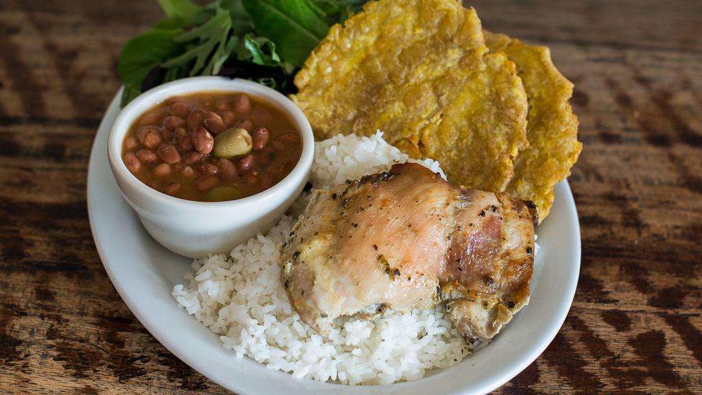 Pollo al Horno · Baked boneless skinless chicken thighs served with salad, rice, beans, and plantains.
