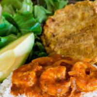 Camarones Criollos · Prawns sautéed with garlic and onion in a tomatoey sauce served with salad, rice, tomato, an...