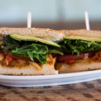 Veggie Deluxe · Avocado, roasted peppers, sautéed onions, organic greens, tomato, jack cheese, and cilantro-...