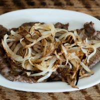Bistec a la Carta · 2 pieces. Thinly sliced steak and sauteed onions.