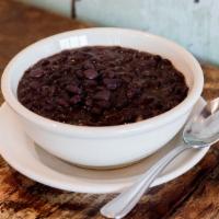 Frijoles Negros · Black beans simmered with peppers, onion and cilantro.
