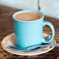 Café con Leche · Sweetened espresso and steamed milk.