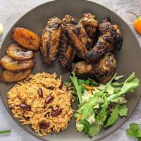 Jerk Chicken Wings Plate · Grilled chicken wings marinated in spicy jerk seasoning served with plantains, rice and kidn...