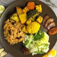 Vegan Curry Tofu Plate · Vegan plate with grilled tofu marinated in curry sauce and cooked with broccoli, carrots, pe...