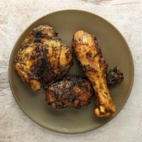 Jerk Chicken Side · Three pieces of spicy and delicious jerk chicken served with jerk sauce.