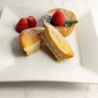 Coconut Custard Cake · Two rich and moist coconut custard cakes with hints of almond.