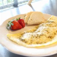 Omelette · Two-egg omelet served with housemade Challah toast and fruit. Add ham, spinach, and/or tomato.