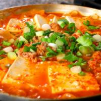 Kimchi Jigae · Spicy. Kimchi stew with pork, tofu and vegetables.