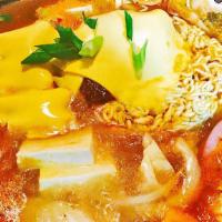 56. Budae Jigae · Spicy. Spicy mixed sausage stew with ramen,tofu,cheese,vegetables and kimchi