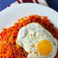 44. Kimchi Fried Rice · Spicy. Vegetarian. Stir rice with kimchi topped with a fried egg.