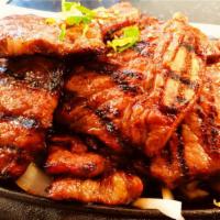 14. BBQ Short Rib (Kalbi) · Top quality premium beef short rib marinated in tradition Korean BBQ sauce