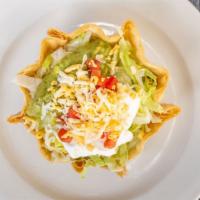 Taco Salad · Served on a flour tortilla shell with rice, beans, lettuce, tomato, cheese, sour cream, guac...