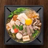 Lamb Hot Soup · A decadent savory and sour broth with favorites such as lamb, tofu skin, fish cake, and mush...