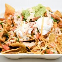 Veggie Nachos · Corn tortilla chips with a choice of toppings, including black beans, cheese, sour cream, fa...