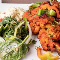 Tandoori Chicken 4 pc (2 Leg) · A traditional Indian dish of flavors. Marinated chicken roasted in clay oven.