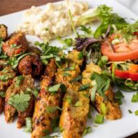 Chicken Seekh Kabab · Ground minced chicken with a mixture of spices onto skewers and grilled.