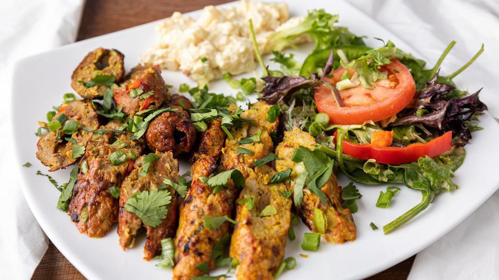 Chicken Seekh Kabab · Ground minced chicken with a mixture of spices onto skewers and grilled.