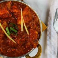 Chicken Vindaloo · Chicken and potatoes in tangy spicy chili sauce.
