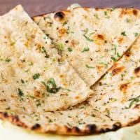 Garlic Naan · Delicious Fresh garlic and cilantro topping whole wheat flour flatbread.