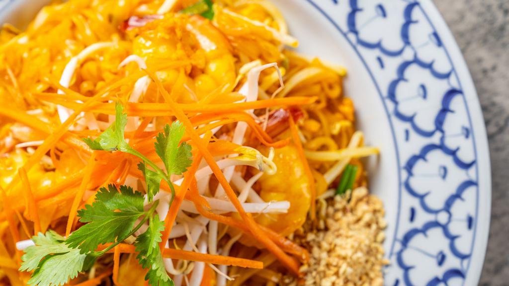 Pad Thai · Sweet rice noodles stir-fried with eggs, green onions, crushed peanut and beansprouts.