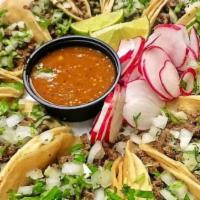 Taco Salad · Tortilla bowl filled with rice, pinto or black beans, lettuce, guacamole, cream, pico De gal...