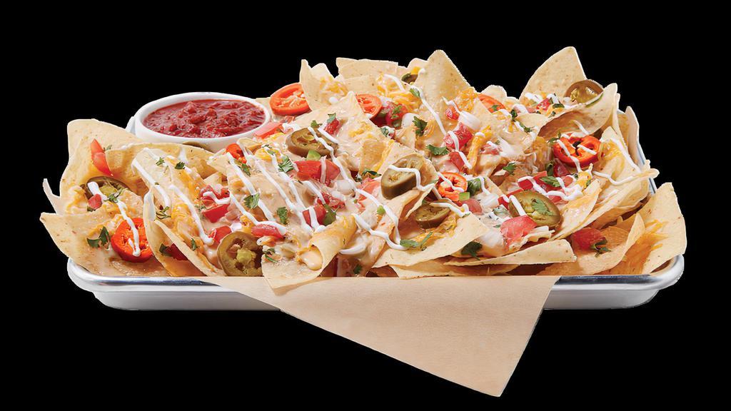 Ultimate Nachos · DOUBLE-LAYERED / HOUSE-MADE TORTILLA CHIPS / HATCH QUESO / CHEDDAR-JACK CHEESE / HOUSE-MADE PICO DE GALLO / PICKLED HOT PEPPERS / CREMA / CILANTRO / SALSA