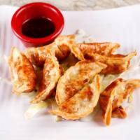 Pot Stickers · Chicken and veggie pot stickers served with soy sauce