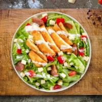 Crispy Cluck Salad · Iceberg lettuce, crispy chicken tenders, red onions, fresh Roma tomatoes, cheddar cheese, mo...