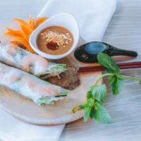 04. Gỏi Cuốn - Spring Rolls · Two rolls. Fresh shrimp, pork and green salad wrapped with rice paper, served with peanut sa...