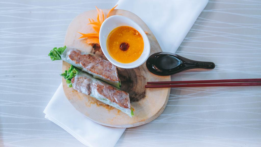 05. Nem Nướng - Grilled Pork Rolls · Two rolls. Grilled minced pork, crispy wonton wraps, green salad wrapped in rice paper, served with house crab sauce.