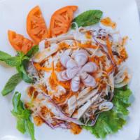 10. Grilled Chicken Salad · Grilled chicken, crispy noodle, lettuce, cucumber, bean sprout, carrot, tomatoes, daikon, on...