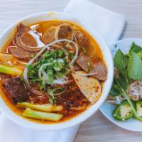 45. Bún Bò Huế - Spicy Beef Noodle Soup · Beef shank, pork hock, pork ham and cube of blood with thick vermicelli.