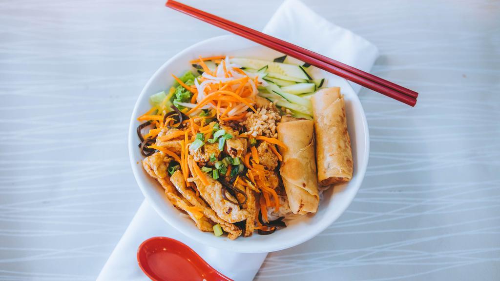 51. Bún Chay - Veggie Vermicelli · Spicy and crispy lemongrass tofu, stir-fried carrot, salted daikon and mushroom served with veggie fried rolls and vermicelli.