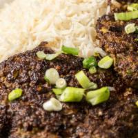 Chapli Kabob · Grilled Afghan style burger (ground beef) mixed with green onions and spices.