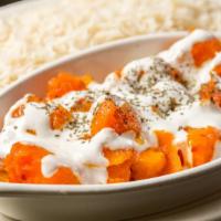 Veggie Borani Kadoo · Butternut pumpkin cooked with garlic, spices and topped with special homemade yogurt sauce.