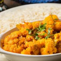 Veggie Cauliflower · Cauliflower cooked with fresh tomatoes, onions and served with white rice.