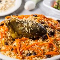 Qabili Palau · Basmati rice seasoned with Afghan spices served with choice of lamb shank or chicken topped ...