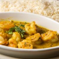 Shrimp Curry · Grilled shrimp cooked with a delicious curry sauce and special spices served with rice.