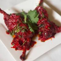 Chicken Lolipops · Batter fried drumsticks tossed a spicy Szechwan sauce.