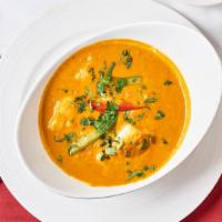 Fish Curry · Traditional Goan fish cooked with fresh coconut, herbs and spices.