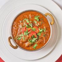 Lamb Xacuti · Traditional curry of Goa. Boneless lamb cooked with fresh coconut, spices, white poppy seeds...
