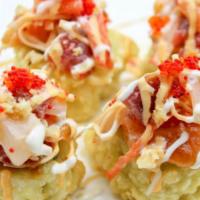 Fat Boy Mix · Deep fried California roll topped with assorted fish, scallop, crab, mixed tobiko MAC nuts a...