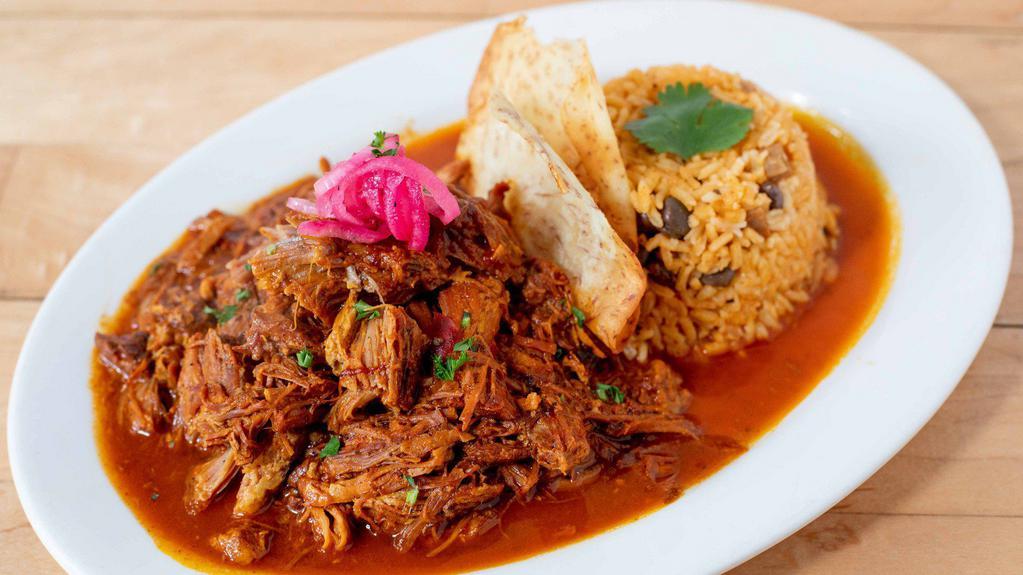 *Lechon Horneado - Roasted Pork · succulent roasted pork marinated in a garlic, achiote (annatto) seasoning blend. Served with white rice.