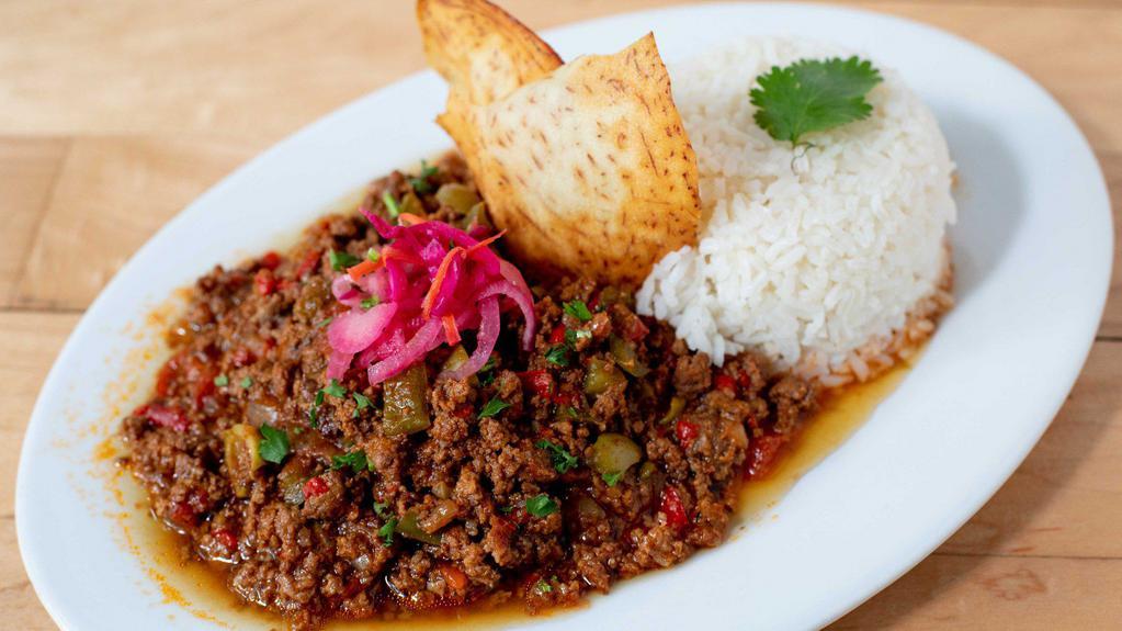 *Picadillo a la Havana - Cuban Ground Beef · Traditional Cuban ground beef, simmered in Cuban spices, with bell peppers, raisins and green olives.  Served with white rice.