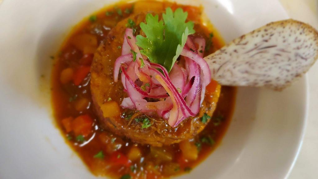 *Veggie Mofongo Plate · Traditional Puerto Rican dish! Garlic flavored mashed green plantains in a wooden pilón.  Formed into a plantain bowl and filled with mixed vegetables, then topped with a sofrito vegetable sauce on top. Served with white rice.